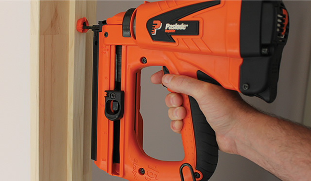 Paslode nail gun being used on door surround